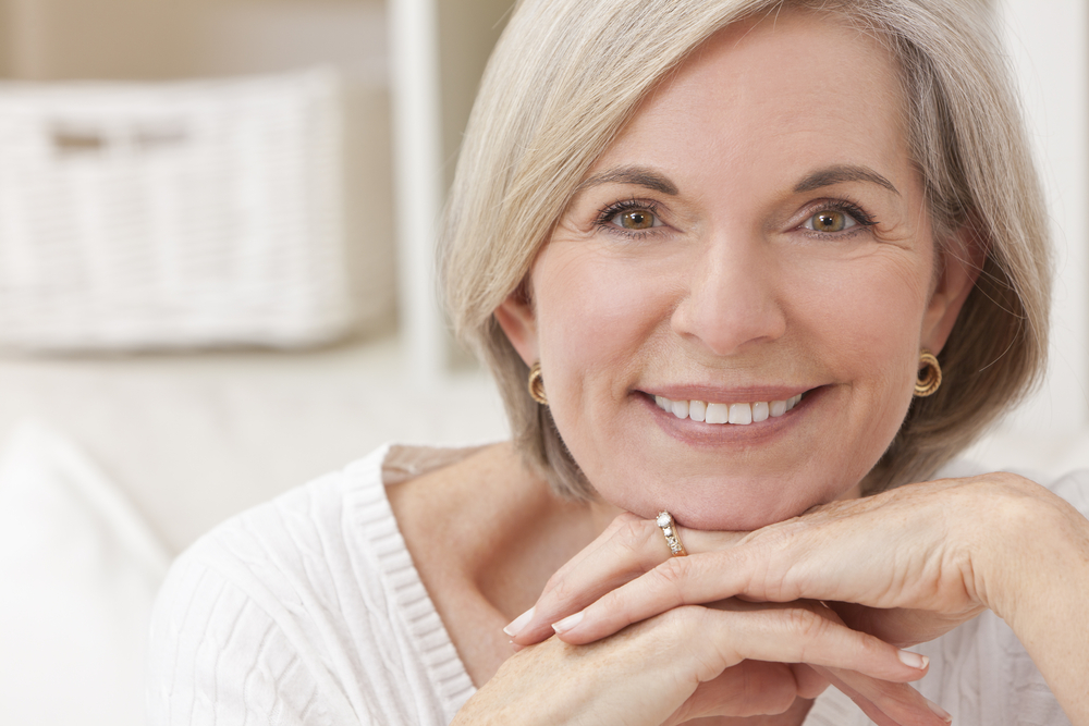 Portrait of an attractive elegant senior woman relaxing at home.