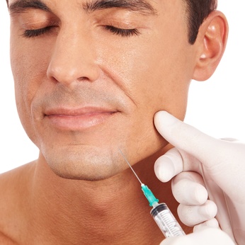 Attractive man getting facial injection