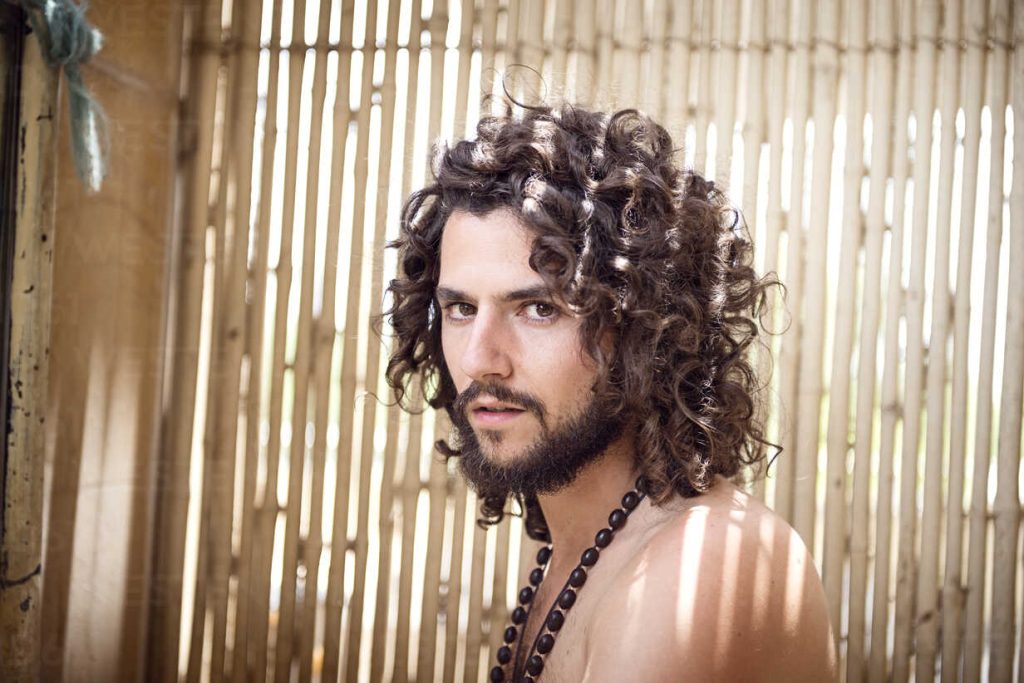 Portrait of man with beard and curly hair